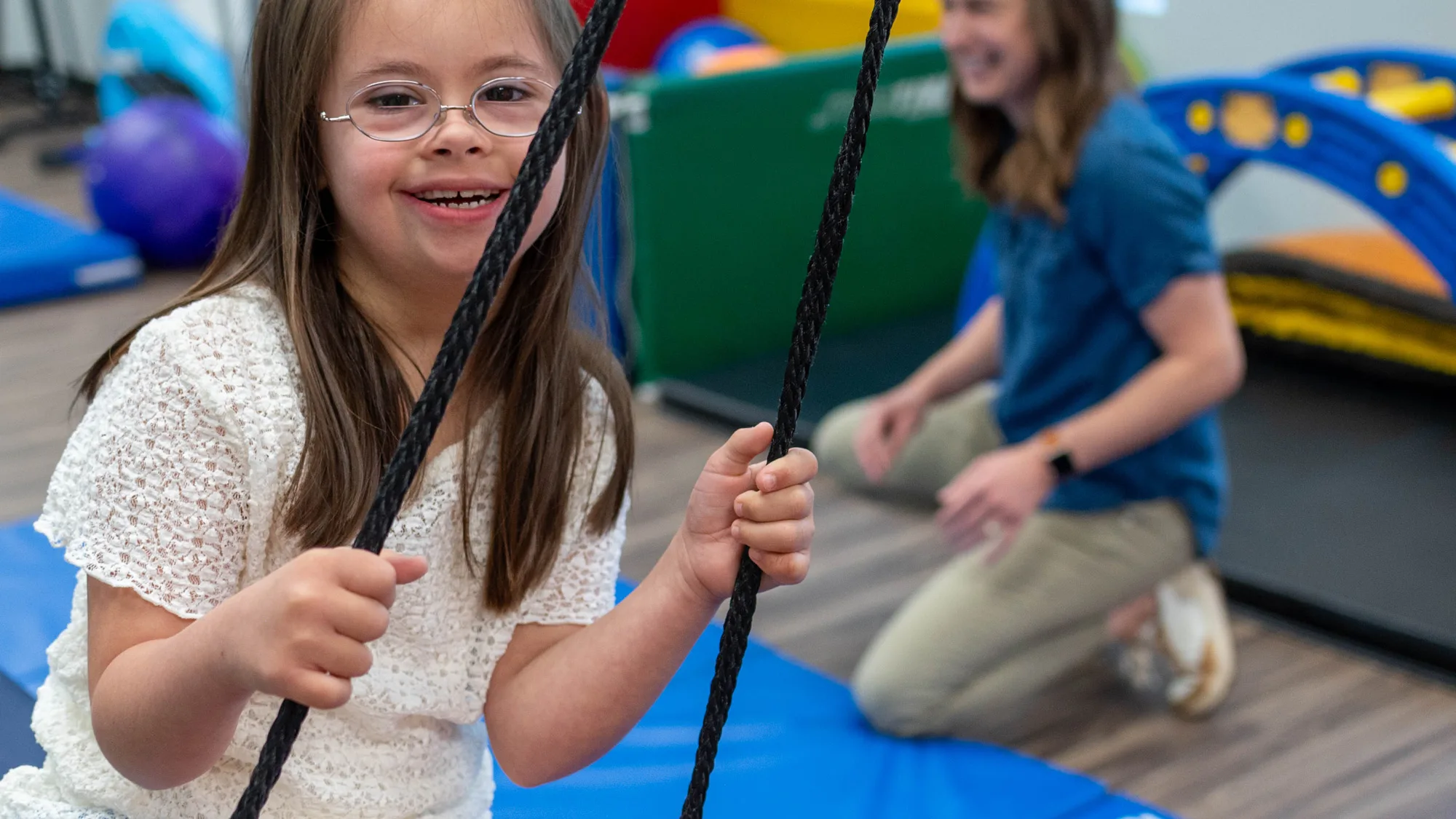 smiling girl on swing